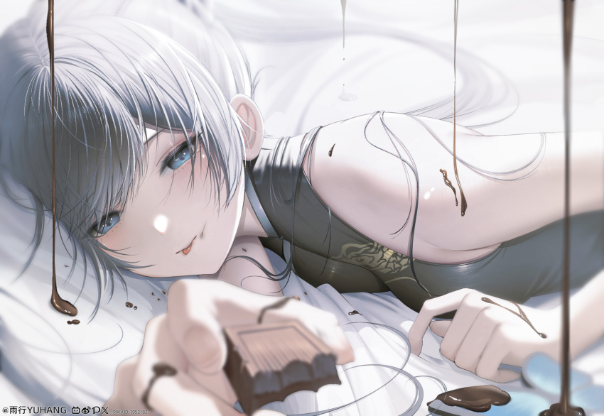 :p artist_name bare_shoulders bed_sheet black_hair blue_archive blue_eyes blurry blurry_background blush breasts chocolate chocolate_on_body dress female food food_on_body highres holding holding_chocolate holding_food incoming_food kisaki_(blue_archive) long_hair looking_at_viewer lying melting on_bed on_stomach paid_reward_available sleeveless sleeveless_dress smile solo tongue tongue_out twintails upper_body yuxing_yuhang