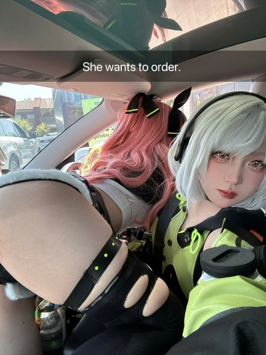 2girls anby_demara ass car_interior cosplay_photo english_text he_wants_to_order_(meme) headphones highres kusa_cos long_hair looking_at_viewer meme multiple_girls nicole_demara nonoli photo_(medium) pink_hair red_eyes short_hair thigh_strap white_hair zenless_zone_zero