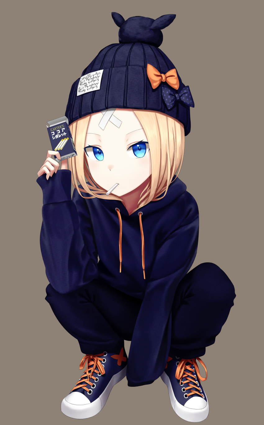 abigail_williams_(fate) absurdres beanie black_bow black_hat blonde_hair blue_eyes blue_footwear blue_hoodie blue_pants blush bow brown_background candy cigarette_candy commentary crossed_bandaids drawstring fate/grand_order fate_(series) female food full_body hand_up hat hat_bow highres holding hood hood_down hoodie long_hair long_sleeves looking_at_viewer mouth_hold orange_bow orion_(company) orion_cocoa_cigarettes pants parted_bangs print_bow sanpeita shoes simple_background slav_squatting sleeves_past_fingers sleeves_past_wrists sneakers solo spread_legs squatting star_(symbol) star_print translated