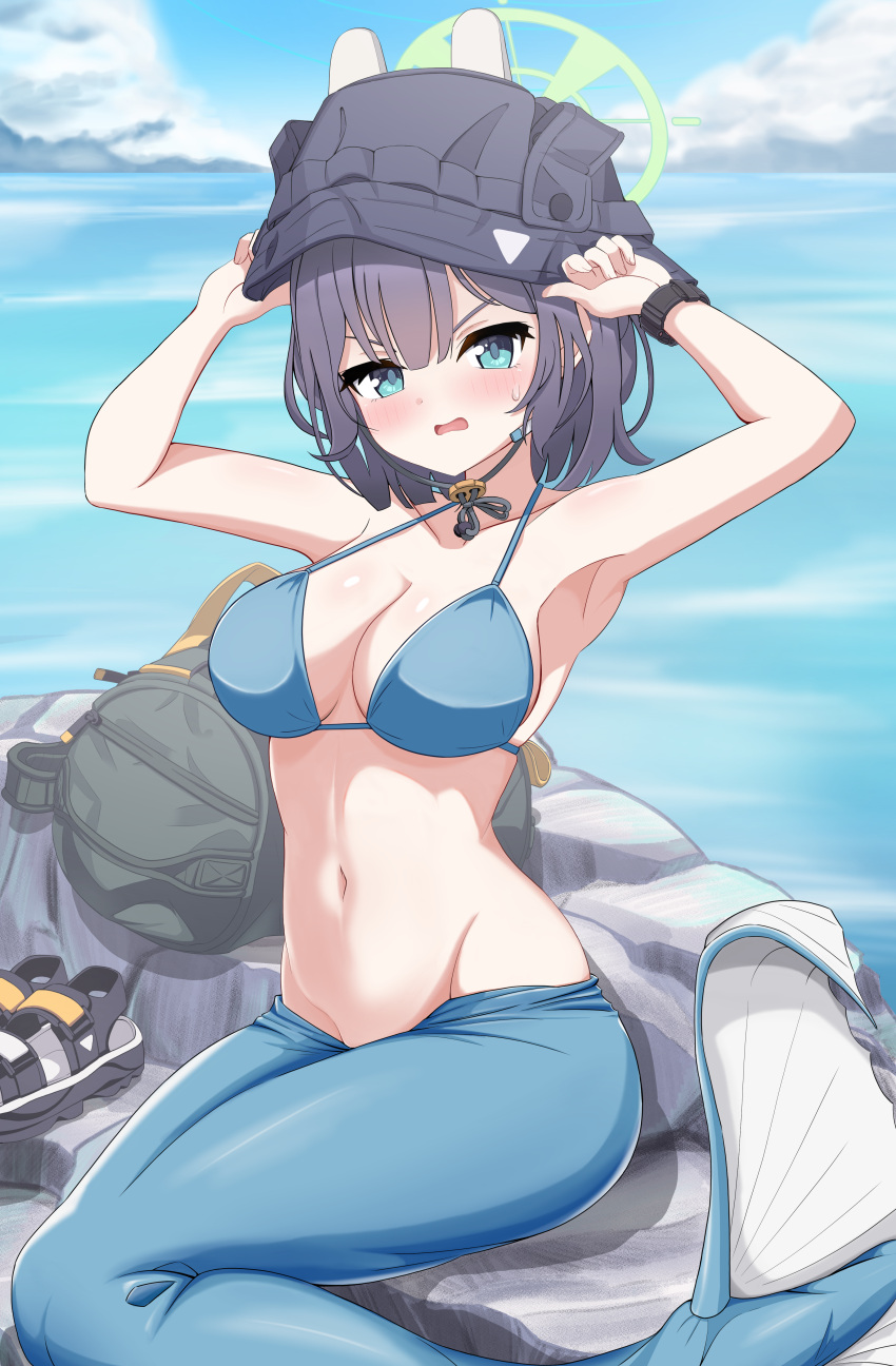 absurdres arms_up backpack bag bikini black_headwear blue_archive blue_bikini blue_eyes blue_hair blush breasts commentary_request dark_blue_hair day female halo highres looking_at_viewer medium_breasts medium_hair mermaid_costume monofin navel ocean official_alternate_costume outdoors parted_lips poorunii rock saki_(blue_archive) saki_(swimsuit)_(blue_archive) sitting solo stomach swimsuit variant_set watch wristwatch