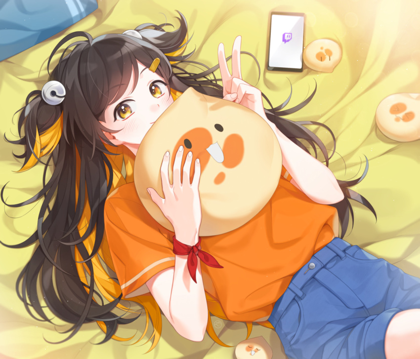 ahoge bell blonde_hair blue_shorts brown_hair closed_mouth commentary_request female hair_bell hair_ornament highres korean_commentary looking_at_viewer lying multicolored_hair on_back on_bed orange_shirt original pillow shirt short_shorts short_sleeves short_twintails shorts smile solo sooryang tam_tambourine thighs twintails yellow_eyes