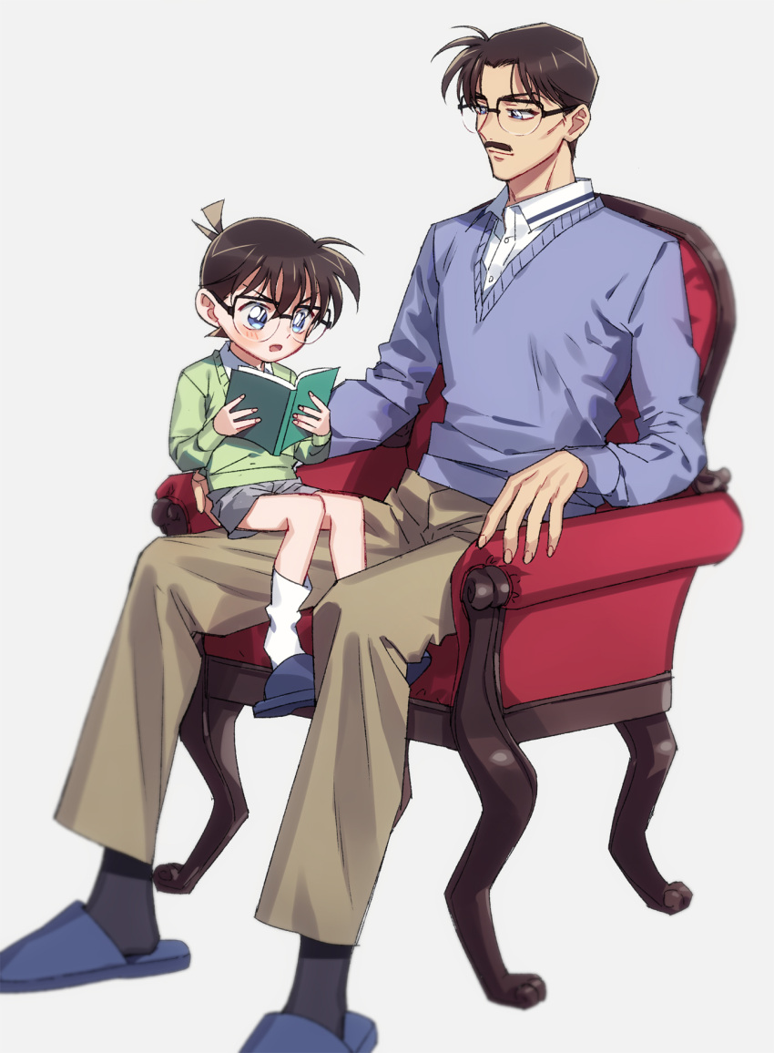 2boys armchair black-framed_eyewear black_socks blue_cardigan blue_eyes blue_footwear blurry book brown_hair brown_pants buttons cardigan chair closed_mouth collared_shirt commentary_request depth_of_field dress_shirt edogawa_conan facial_hair father_and_son fingernails glasses green_cardigan grey_shorts height_difference highres holding holding_book k_(gear_labo) kudou_yuusaku lolicon long_sleeves looking_at_another looking_down male_focus meitantei_conan moustache multiple_boys on_chair open_book open_mouth pants reading shirt short_hair shorts simple_background sitting sitting_on_lap sitting_on_person slippers smile socks white_background white_shirt white_socks