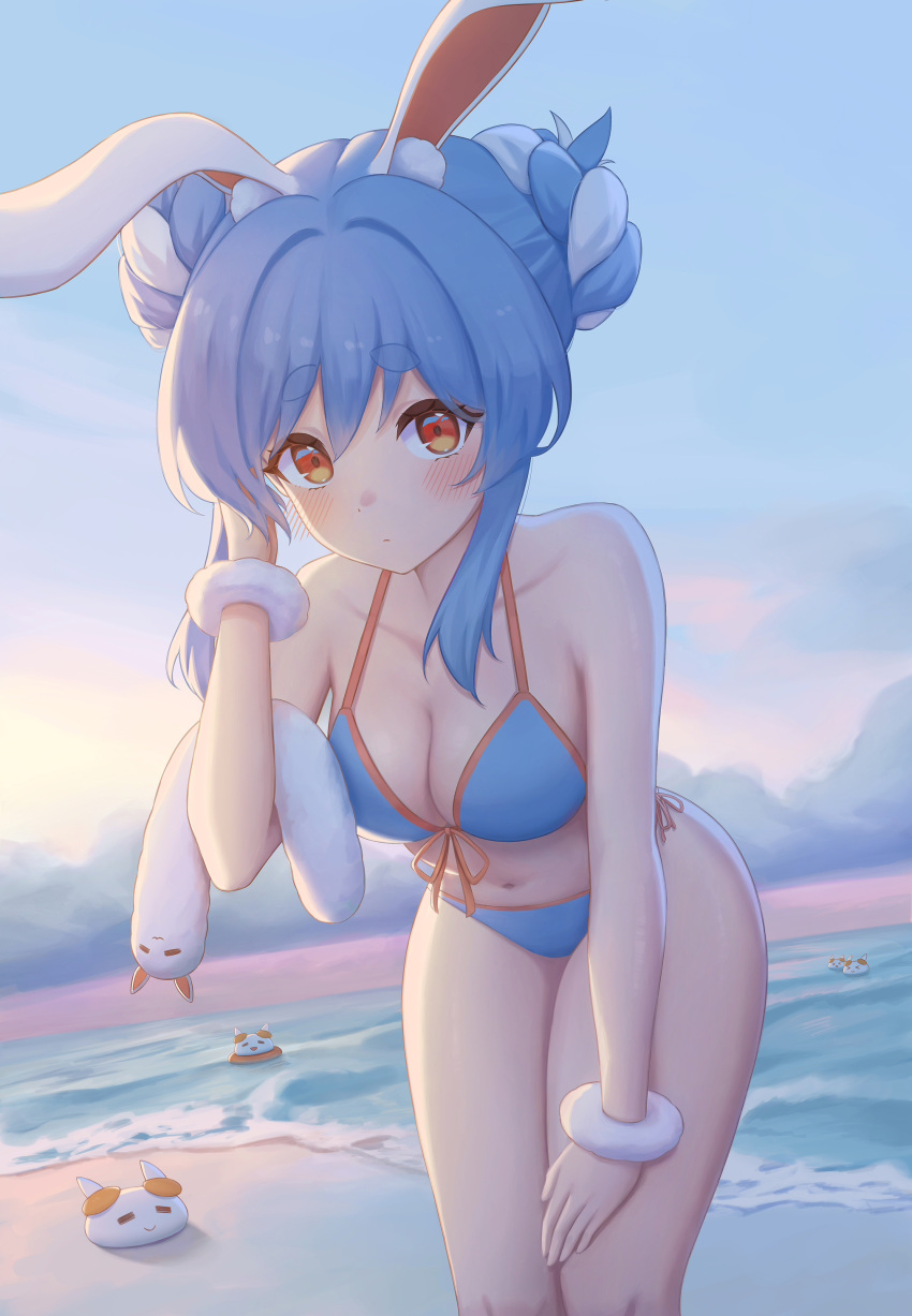 absurdres animal_ears bangs beach bent_over bikini blue_bikini blue_hair blush breasts cleavage closed_mouth collarbone don-chan_(usada_pekora) double_bun female front-tie_top hand_on_own_knee hand_up highres hololive leaning_forward looking_at_viewer medium_breasts multicolored_hair navel nousagi_(usada_pekora) ocean orange_eyes rabbit_ears rabbit_girl sand shirt short_eyebrows side-tie_bikini solo swimsuit two-tone_hair usada_pekora virtual_youtuber water white_shirt wrist_cuffs yihsien