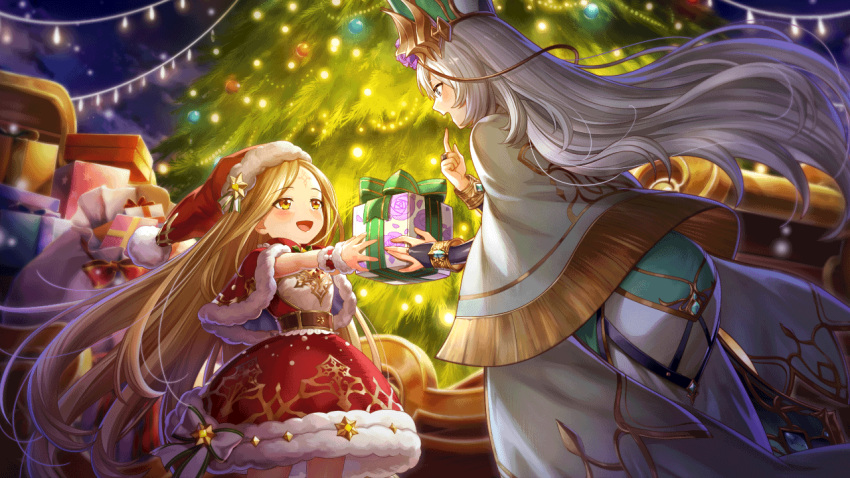 2girls alternate_costume blonde_hair christmas christmas_lights christmas_ornaments christmas_tree gift hat long_hair multiple_girls official_art open_mouth santa_costume santa_hat sortishia valkyrie_connect vili white_hair yellow_eyes