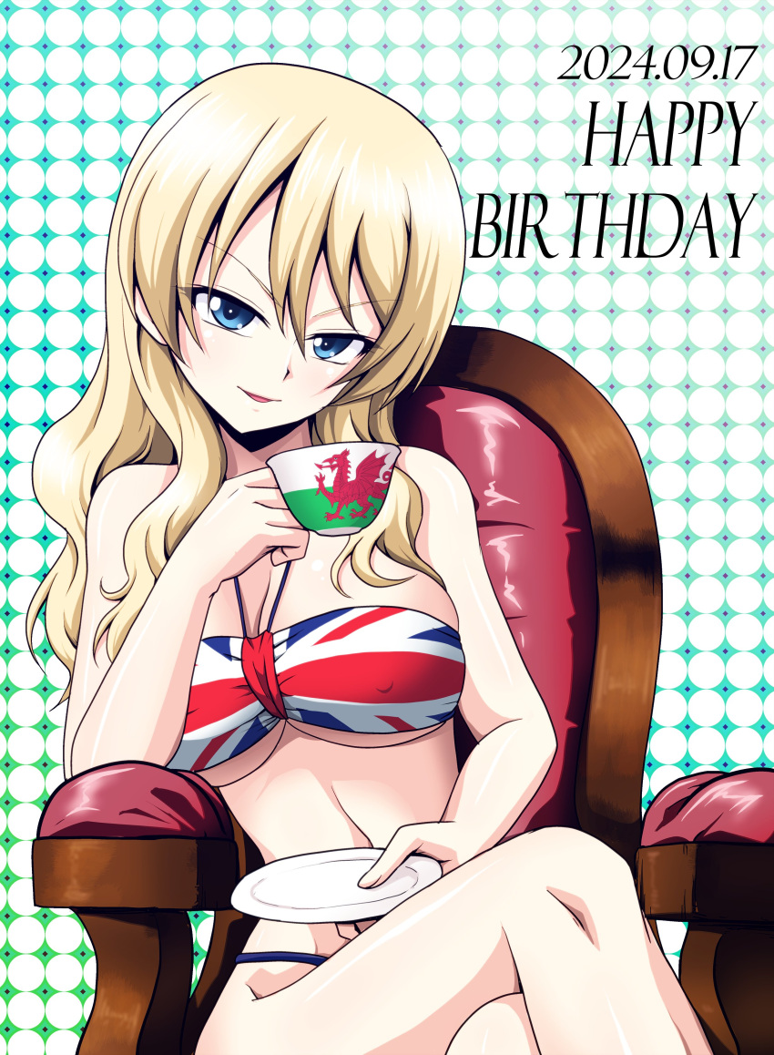 2024 absurdres alternate_costume alternate_hairstyle blonde_hair blue_eyes breasts crossed_legs cup darjeeling_(girls_und_panzer) dated female girls_und_panzer hair_down happy_birthday highres holding holding_cup kamishima_kanon large_breasts long_hair looking_at_viewer on_chair polka_dot polka_dot_background sitting teacup union_jack union_jack_bikini welsh_flag welsh_flag_print