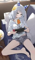  alternate_costume animal_ears bare_legs barefoot breasts brown_eyes commentary couch desk ear_covers ear_ornament feet female foot_out_of_frame grey_hair grey_shorts highres hishi_miracle_(umamusume) horse_ears horse_girl horse_tail indoors juice_box legs looking_at_viewer medium_breasts medium_hair ningen_gokko nintendo_switch on_couch open_mouth pillow shirt short_shorts short_sleeves shorts smile solo tail toenails toes umamusume white_shirt 