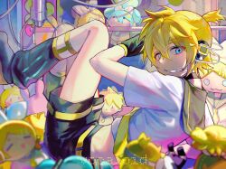  1boy black_footwear black_leg_warmers black_shorts blonde_hair character_doll chinese_commentary closed_mouth commentary_request copyright_name crane_game hatsune_miku highres iuew kagamine_len kagamine_rin leg_warmers legwear_garter light_frown long_sleeves male_focus shirt shorts solo vocaloid white_shirt 