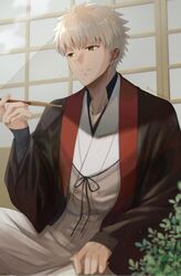  1boy commentary_request emiya_shirou fate/grand_order fate_(series) highres holding japanese_clothes leaf long_sleeves male_focus mct nagatekkou open_mouth plant senji_muramasa_(fate) senji_muramasa_(third_ascension)_(fate) short_hair smile solo wooden_door yellow_eyes 