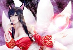 9_tails ahri_(lol) asian_clothing asian_mythology black_hair canid canine charm_(disambiguation) clothing cosplay dress east_asian_clothing east_asian_mythology energy_ball fake_ears fake_fox_ears female fox fox_spirit grandfathered_content hair human japanese_clothing league_of_legends looking_at_viewer magic mammal multi_tail mythology riot_games solo tail tencent unknown_artist