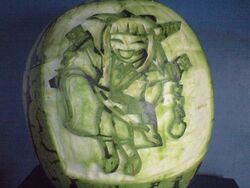  carving character_cutout commentary_request craft food food_art_(medium) food_focus fruit ibuki_suika no_humans photo_(medium) ringo_no_majutsushi touhou unconventional_media watermelon 