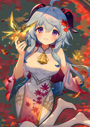  ahoge ainy alternate_costume arm_support artist_name autumn autumn_leaves bare_shoulders barefoot bell blue_hair blush breasts bug butterfly china_dress chinese_clothes commentary crystal crystalfly_(genshin_impact) curled_horns detached_sleeves dress female ganyu_(genshin_impact) genshin_impact gold_trim hair_ornament highres horns leaf leaf_hair_ornament long_hair looking_at_viewer maple_leaf medium_breasts neck_bell purple_eyes sidelocks sitting smile soles solo twitter_username white_dress yokozuwari 