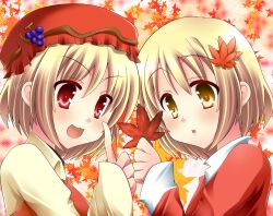  2girls aki_minoriko aki_shizuha autumn autumn_leaves blonde_hair blush commentary_request hair_ornament hat highres leaf leaf_background leaf_hair_ornament leaf_on_head mashiro_yuki multiple_girls red_eyes short_hair siblings sisters touhou yellow_eyes 