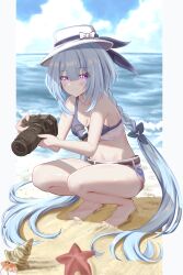  absurdres beach bikini bikini_top_only blue_bikini blue_hair braid camera closed_mouth commentary denim denim_shorts female full_body griseo hat hermit_crab highres holding holding_camera honkai_(series) honkai_impact_3rd light_blue_hair long_hair looking_at_viewer ocean official_alternate_costume purple_eyes sand shorts solo squatting starfish swimsuit twin_braids very_long_hair white_hat zhuluoluo 