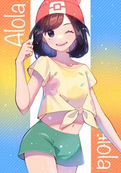  ;d beanie black_hair collarbone commentary_request cowboy_shot eyelashes female green_shorts grey_eyes hand_up hat highres kana_(kanna_runa0620) medium_hair midriff navel one_eye_closed open_mouth pink_hat pokemon pokemon_sm selene_(pokemon) shirt short_sleeves shorts smile solo stomach t-shirt teeth tied_shirt yellow_shirt 