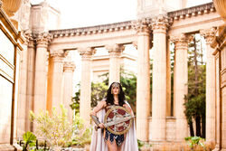  amazon architecture armor black_hair cape column cosplay dc_comics female meagan_marie outdoors photo pillar pteruges shield solo sword vambraces weapon wonder_woman wonder_woman_(cosplay) wonder_woman_(series) 