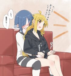  2girls ahoge alternate_costume between_legs black_hoodie blonde_hair blue_hair blush bocchi_the_rock! clueless commentary_request couch hand_on_another&#039;s_crotch hood hoodie ijichi_nijika look4_osagashi mole mole_under_eye multiple_girls on_couch red_eyes rubbing sitting sitting_on_person sweater thighhighs translation_request white_sweater yamada_ryo yuri 