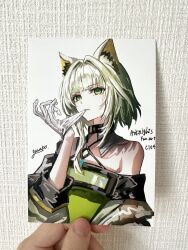  absurdres adjusting_clothes adjusting_gloves animal_ears arknights artist_name bare_shoulders biting copyright_name dress female gawako glove_biting glove_pull gloves green_dress green_eyes green_hair hair_intakes hand_up highres kal&#039;tsit_(arknights) looking_at_viewer off_shoulder photo_(medium) short_hair_with_long_locks signature solo traditional_media upper_body white_gloves 