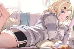  absurdres aizawa_ema barefoot black_shorts blonde_hair blue_eyes blurry blurry_background blurry_foreground blush braid couch cowboy_shot dolphin_shorts facing_away feet_up female grey_hoodie highres hood hood_down hoodie long_hair looking_at_viewer looking_back lying on_couch on_stomach parted_lips ruo19 short_shorts shorts smile solo striped_clothes striped_hoodie thighs twin_braids virtual_youtuber vspo! 