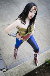  amazon black_hair boots cosplay dc_comics female hands_on_hips pants photo solo strapless tiara wonder_woman wonder_woman_(cosplay) wonder_woman_(series) 