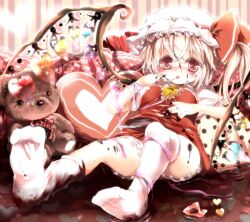  alternate_wings bad_id bad_pixiv_id blonde_hair blush chocolate emia_(castilla) female flandre_scarlet food food_on_face hat hat_ribbon heart heart-shaped_pillow heart_wings lying no_shoes on_back open_mouth pillow red_eyes ribbon shirt short_hair side_ponytail skirt solo stuffed_animal stuffed_toy teddy_bear tongue tongue_out touhou upshirt wings wrist_ribbon 