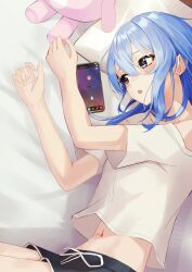  absurdres bed black_shorts blue_hair blush cellphone commentary_request cowboy_shot crop_top discord double-parted_bangs female grey_eyes hair_between_eyes highres hololive hoshimachi_suisei indoors long_hair lying midriff navel off-shoulder_shirt off_shoulder on_bed on_side open_mouth phone pillow shirt short_shorts shorts smallpine_7 smartphone solo stuffed_animal stuffed_toy t-shirt virtual_youtuber white_shirt 