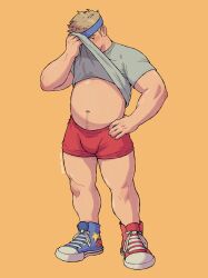  1boy artist_name bara blonde_hair blue_footwear blue_headband blush clothes_lift full_body grey_eyes grey_shirt headband highres looking_at_viewer male_focus muscular muscular_male navel navel_hair original plump red_footwear red_shorts shirt shirt_lift shoes short_hair short_sleeves shorts simple_background sneakers solo standing star_(symbol) star_print twitter_username vit_(vitamin_bara) 