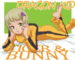  bad_id bad_pixiv_id barefoot blonde_hair bruce_lee&#039;s_jumpsuit character_name copyright_name feet female flower green_eyes hair_flower hair_ornament huang_baoling lying on_stomach rduuroorn short_hair solo the_pose tiger_&amp;_bunny 