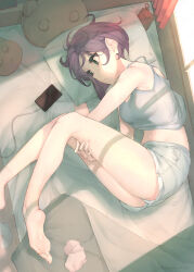  bare_legs bare_shoulders barefoot breasts camisole cellphone closed_mouth commentary_request feet female fetal_position green_eyes grey_camisole grey_shorts highres inaba_makoto indoors legs lying medium_breasts midriff on_bed on_side original phone pillow purple_eyes short_hair shorts smartphone socks soles solo unworn_socks white_socks 