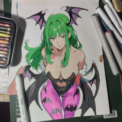  ashwin_artss black_leotard breasts cleavage darkstalkers female green_hair head_wings highres leotard long_hair looking_at_viewer morrigan_aensland pantyhose photo_(medium) purple_pantyhose solo strapless strapless_leotard wings yellow_eyes 