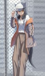  absurdres alternate_costume arknights arm_up baseball_cap black_hair black_tail blush breasts brown_jacket brown_pants chain-link_fence cleavage closed_mouth commentary_request feet_out_of_frame female fence grey_hat hair_between_eyes hand_in_pocket hand_on_headwear hat headphones headphones_around_neck highres jacket leaning light_smile long_hair long_sleeves off_shoulder open_clothes open_jacket pants salt_on_dice scoop_neck shirt shirt_tucked_in solo standing t-shirt tail texas_(arknights) unzipped white_hat white_shirt wolf_girl wolf_tail yellow_eyes 