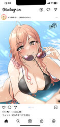  ahoge arisugawa_natsuha bikini black_bikini blue_sky blurry blurry_foreground blush breasts character_name cleavage collarbone depth_of_field fake_screenshot female foreshortening highres holding holding_eyewear idolmaster idolmaster_shiny_colors instagram large_breasts light_rays looking_at_viewer lying on_stomach orange_hair phone_screen sian signature sky smile solo sunglasses swimsuit wavy_hair 